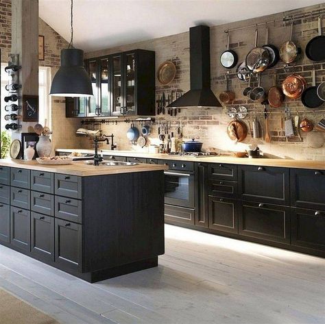 Timeless kitchen with brick walls and black wood cabinets along with wooden countertops - Decoist Backsplash Dark Cabinets, Industrial Kitchen Design Ideas, Kitchen With Brick Wall, Dapur Rustic, Backsplash With Dark Cabinets, Interior Dapur, Industrial Kitchen Design, Kabinet Dapur, Brick Kitchen