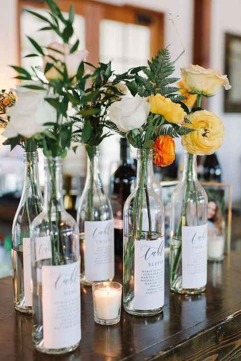 wine bottles. seating plans wedding decor diy Charming Wedding Reception Tables Of Wine Barrels | sustainable | Eco-friendly wedding | Wedding Table Number Idea | Wine Bottle Table Numbers | rustic wedding | Elegant wedding | Cork decorations | Unique Wedding Ideas | Seating ideas | DIY Wedding Ideas #rusticwedding #weddinginspo #vineyardwedding #weddinginthewoods #rustic weddings Unique Wedding Ideas Diy, Wine Bottle Wedding Decor, Wine Bottle Table Numbers, Creative Wedding Table Numbers, Bottle Table Numbers, Wedding Ideas Diy, Wine Bottle Table, Wine Bottle Centerpieces, Wedding Wine Bottles