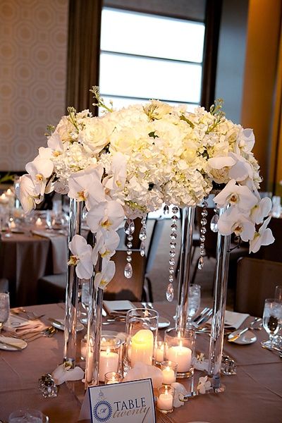 Clear Beautiful Wedding Centerpiece. Inside the glass you put battery powered tea lights White Flower Centerpieces, Decoration Buffet, Beautiful Wedding Centerpiece, Dinner Reception, Pennsylvania Wedding, White Wedding Flowers, Flower Ideas, Center Pieces, Reception Ideas