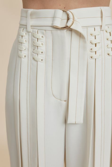 The Haywood Pant in Coconut are designed to be fitted at the waist and relaxed toward the hem. An updated suiting silhouette featuring lace up detail, soft pleats through the legs, contrast top stitching and a luxurious d-ring belt with gold hardware. Pair back with the Haywood Jacket for a complete look. - High waist fit - Full length pant - Front fly closure - Detachable belt - Vertical pleating Model is 180cm / 5'10″ wearing an AU 8 / US 4 Composition: 80% Polyester, 16% Viscose Rayon, 4% Ela Body Shape Style Guide, Clothing Hardware, Waist Belt Outfit, Body Shape Outfits, Pear Body Shape Fashion, Pear Body Shape Outfits, Zipper Fashion, Pear Body, Pear Body Shape