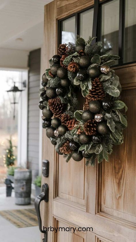 Are you thinking of switching up your Christmas decor this year? If you’re tired of the traditional red and white, black and green could be the fresh, modern look you’re after. Here are 30+ Black And Green Christmas Decor Ideas for your Christmas home decor. Green Christmas Decor Ideas, Black And Green Christmas Decor, Green Pillar Candles, Green Christmas Decor, Winter Porch Decor, Neutral Holiday Decor, Reindeer Figure, Rustic Christmas Wreath, Wooden Reindeer