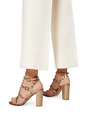 Valentino Garavani Rockstud sandals in metallic calfskin leather.. Matching studs. Tone-on-tone adjustable straps. Heel height 90 mm / 3.5 in. Made in Italy. Valentino Studded Heels, Valentino Rockstud Shoes, Heels Outfits, Valentino Shoes, T Strap Sandals, Crazy Shoes, Valentino Studs, Ankle Strap Sandals, High Heel Sandals