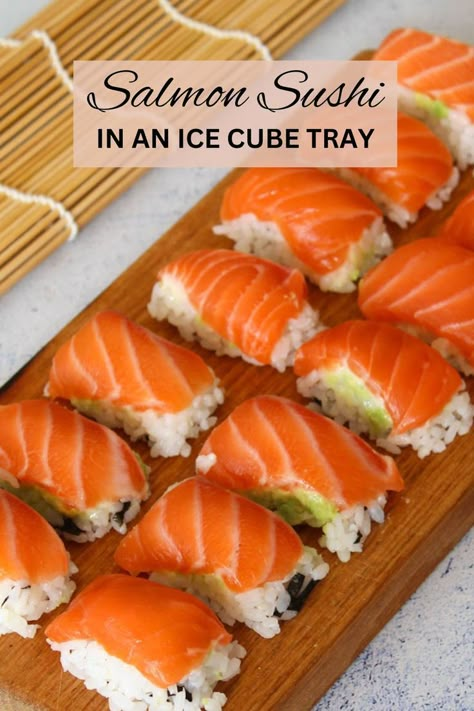 salmon nigiri on a wooden chopping board Sushi In Ice Cube Tray, Ice Tray Sushi, Sushi Ice Cube Tray, Diy Sushi Night, Ice Cube Tray Sushi, Sushi Ideas Homemade, Ice Cube Sushi, Sushi Hacks, Perfect Sushi Rice Recipe