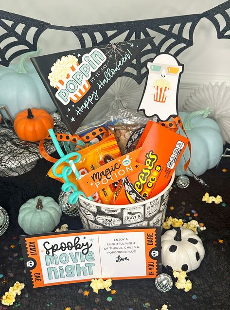 This adorable printable Halloween set is a perfect addition to your spooky movie night gift baskets! Plan a Halloween movie night for your kids or gift to friends and neighbors. Prints on standard 8.5 x 11 inch page. Print as many as you need! Nothing physical will be shipped. Set includes:Spooky Movie Night Card"Poppin by to say Happy Halloween" pennant flag"Magic Potion" straw flagSmall TicketGhost with Popcorn This design is also available in pink: https://pixeldustdesigns.com/products/spooky-movie-night-halloween-movie-night-gift-basket-printables Directions:1. You will receive a pdf download link once payment is complete.2. Easily add a name to card using Adobe Acrobat Reader or simply handwrite name after printing.3. Print on standard 8.5 x 11 inch card stock4. Cut out, fold around w Kids Spooky Basket, Movie Night Basket Ideas, Cute Spooky Basket Ideas For Friends, Halloween Gift Baskets For Kids, Spooky Basket For Him, Boo Basket Ideas For Best Friend, Soda Cakes, Halloween Movie Night Party, Spooky Movie Night