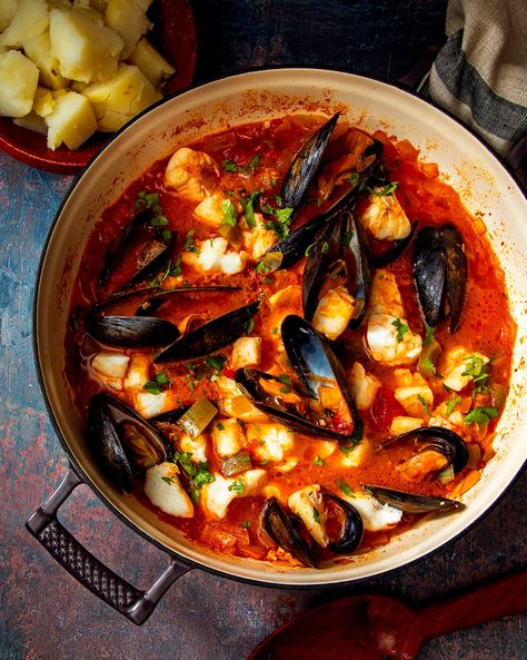 Portuguese Seafood Stew Recipe | Saveur Portuguese Seafood Stew Recipe, Portuguese Seafood, Portuguese Dishes, Seafood Stew Recipes, Canning Whole Tomatoes, Portuguese Cuisine, Tomato Broth, Portuguese Food, Red Onion Salad