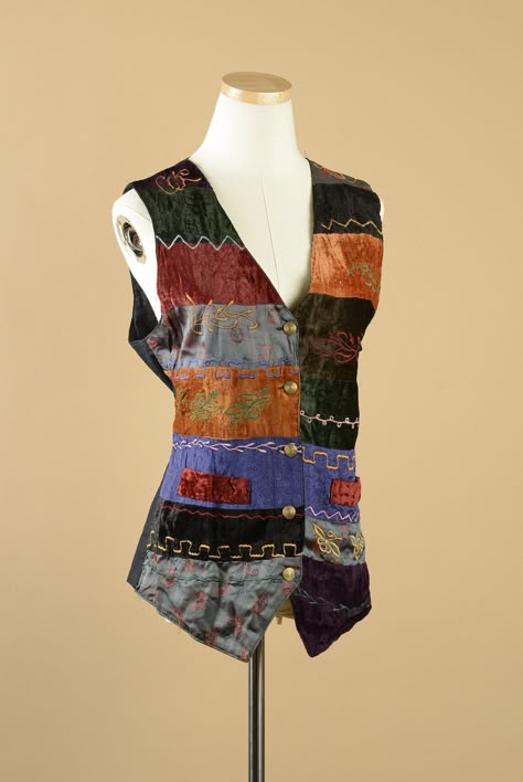 "1980s Creazion Effect abstract bold vest. This vest has large colorblocked stripes with embroidered designs. The embroidered motifs consist of zig zags as well and flowers and leaves. The vest has a v-neck and buttons up the front with 5 gold buttons. The vest has two faux pockets in the front and end terminates with points. The back of the vest is solid black and has a tie to adjust the fit. The front of the vest is 100% rayon and the back is 100% cotton. This vest was made in India and is in excellent condition.  The Size On The Tag: Medium Shoulder to Shoulder: 3.5\"  Sleeve Width: 13\"  Bust: 38\"  Waist: 34\"  Hips: 38\"  Length: 27\"" Crochet Bolero Pattern, 70s Clothes, Mcu Dr, Bolero Pattern, Patchwork Ideas, Noir Uni, Patchwork Vest, Embroidered Motifs, Floral Vests