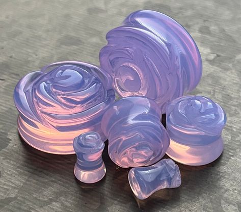 Lavender Opalite Carved Flower Double Flare Plugs Material: Natural Stone Opalite These opalite plugs can range in color from a lavender milky white to almost clear as shown in the photo. Though no two pieces are identical, we do our best to pair pieces that are very similar. Please note that due to the organic nature of this item, color and/or pattern may slightly be different than as shown. Simply order 1 for a complete pair. Feedback: Your satisfaction is important to us. If for any reason yo Stone Plugs Gauges, Gauges Aesthetic, Cute Gauges, Gauge Jewelry, Plug Earrings Gauges, Pretty Plugs, Tapers And Plugs, Ear Gauges Plugs, Stone Plugs