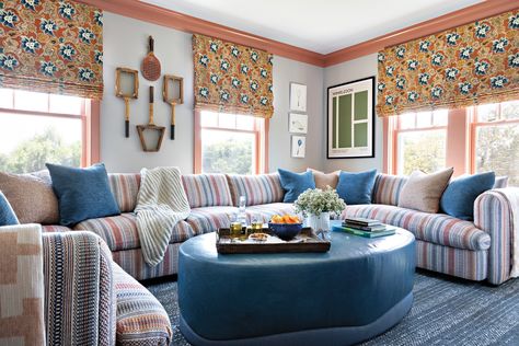 The media room reflects the family’s love of tennis. The sofa is upholstered with Zak+Fox fabric, the ottoman is Cuff Studio and the rug is Stark. Trimwork is painted Farrow & Ball’s Red Earth and the shade fabric is by Le Gracieux. Marc Phillips Rugs, Wicker Coffee Table, Fox Fabric, Red Earth, Scenic Wallpaper, Artistic Tile, Architecture Home, Ranch Style Homes, Luxe Interiors