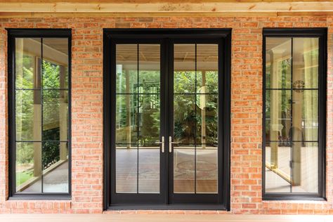 French Doors Next To Windows, French Door Back Door, Black Framed French Doors, Windows With Black Grids, Black Glass French Doors, Dining Room French Doors To Outside, French Doors And Windows, French Doors With Windows On Each Side, Patio French Door Ideas