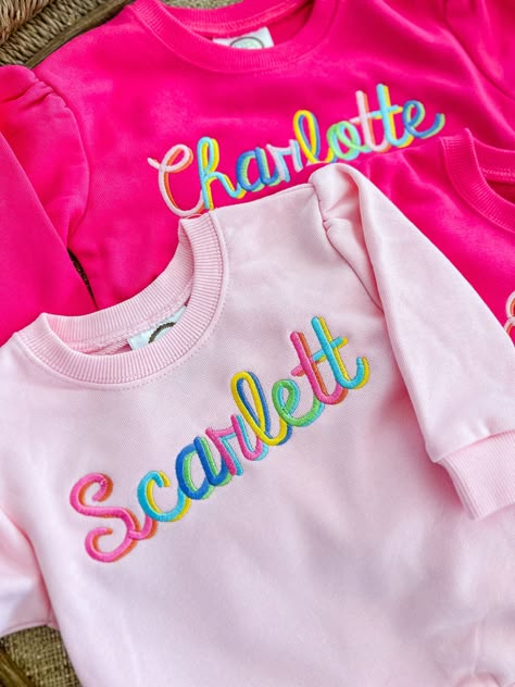 Girls puff sleeve sweatshirt personalized with  name, monogram, and/or motif t in your choice of font and color(s)!       100% Cotton    Naturally Tapered Puffed Shoulder    True to Size    Ribbed Neckline **FOR MORE OPTIONS VISIT https://bogeyandbyrd.com Monogram Sweatshirt Ideas, Preppy Fonts, Etsy Sweatshirts, Name Sweatshirt, Rainbow Names, Monogram Ideas, Cute Shirt Designs, Embroidered Gifts, Machine Embroidery Projects