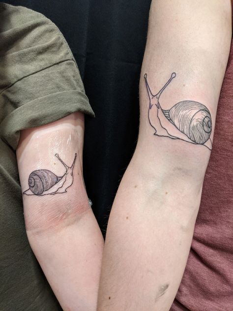 matching snail tattoos with fingerprints on the shells! Botanical Snail Tattoo, Matching Snail Tattoo, Snail Tatoos, Sweet Tooth Tattoo, Snail Tattoo Simple, Matching Nature Tattoos, Snail Tattoos, Snail Tattoo, Tooth Tattoo