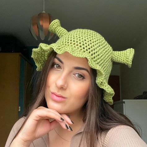 Handmade green crochet Shrek Hat! I made this originally for myself for a funny hat party, and it went a bit crazy on Instagram stories so I've added it to my site for you all to buy! If you love Shrek then this is the perfect little green bucket hat for you - perfect for fancy dress Fiona or Shrek looks and complete with frilled edges so you'll still look 10/10 cute. Choose between 3 Shrek-ky shades of green! I would recommend regular for most people as they are quite stretchy, but if you have quite a large head and/or curly hair that's quite full then I'd go for a large. It's impossible to make these without smiling, I hope you love them as much as I do! <3 Shrek Trunk Or Treat, Crochet Shrek Hat, Boyfriend Crochet, Shrek Crochet, Crochet Shrek, Shrek Hat, Green Bucket Hat, Crocheted Stuff, Hat Party