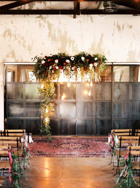 27 Wedding Floral Installations That Will Blow Your Mind | Junebug Weddings Industrial Chic Wedding Decor, Winter Wedding Arch, Industrial Wedding Inspiration, Winter Wedding Planning, Chic Wedding Decor, Industrial Chic Wedding, Wedding Altars, Indoor Ceremony, Jewel Wedding