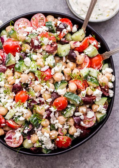 This quick and easy Greek Chickpea Salad with Tzatziki Dressing is great for a vegetarian lunch or dinner. Everything you find in a Greek salad, minus the lettuce and tossed in a creamy, flavorful tzatziki dressing. #salad #greeksalad #chickpeas #vegetarian #glutenfree #tzatziki #dressing Salads With Tzatziki Sauce, Vegetarian Tzatziki Bowl, Greek Salad With Tzatziki Sauce, Tzatziki Sauce Salad, Chickpea Greek Bowl, Chickpea Lentil Salad, Recipes With Tzatziki, Tzatziki Dressing Recipe, Running Recipes