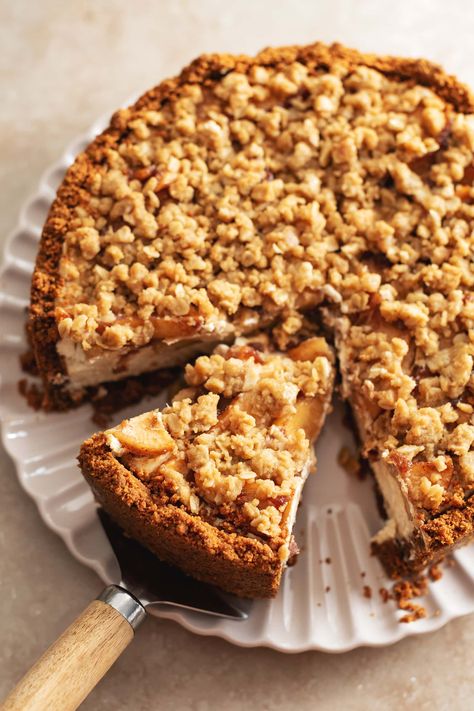 This apple crumble cheesecake is made with a biscoff cookie crust, creamy spiced cheesecake topped with tender cinnamon apples, and a crumble topping. It's the perfect rich and delicious Fall cheesecake! #applecrumble #cheesecake #fallbaking | teakandthyme.com Apple Crumble Cheesecake, Crumb Topping Recipe, German Pastries, Crumble Cheesecake, German Word, Apples And Cheese, Streusel Topping, Crumble Topping, Apple Crumble