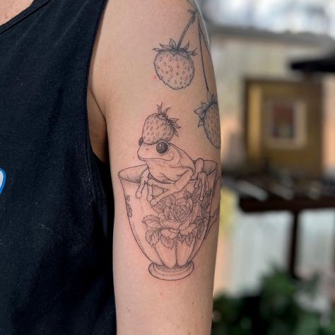 Frog Strawberry Tattoo, Frog And Toadstool Tattoo, Frog In A Teacup Tattoo, Dinosaur In A Teacup Tattoo, Frog And Mushroom Tattoo, Frog Teacup Tattoo, Frog Sitting On Mushroom Tattoo, Frog Tattoo, Frog In Teacup