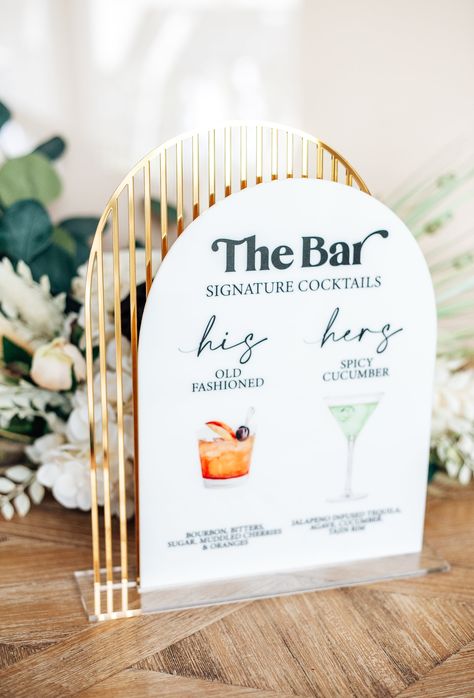 This signature drinks wedding bar sign features a colorful display of the couples' favorite drinks for their guests to indulge in! Presented on a layered acrylic for a gorgeous midcentury modern look!SIZE: 9" inches x 12" inchesPlease include your drink name, graphic choice, acrylic color choices and any other requests in the personalization field when adding to your cart. Mr And Mrs Drinks Wedding, Bar Drink Sign Wedding, Drinks Table Sign, Signature Shots Wedding, Specialty Drink Sign For Wedding, Large Wedding Menu Sign, Wedding Bar Sign Signature Drink, Wedding Spritz Bar, Engagement Party Signature Drink