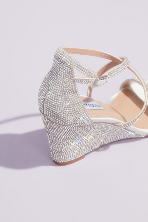 For a chic and comfortable pair of shoes on your big day try this gorgeous wedding-approved wedge. Embellished with crystals from heel to toe, these wedges offer all day comfort and style! | Style OAKLYNN | Shop the designer wedding shoes collection in select David’s Bridal locations or online at davidsbridal.com | #stevemadden #stevemaddenshoes #weddingshoes Wedge Sandals Wedding, Sparkly Wedges, Wedge Wedding Shoes, Designer Wedding Shoes, White By Vera Wang, Bridal Wedding Shoes, Block Sandals, Glitter Pumps, Heart Shaped Necklace