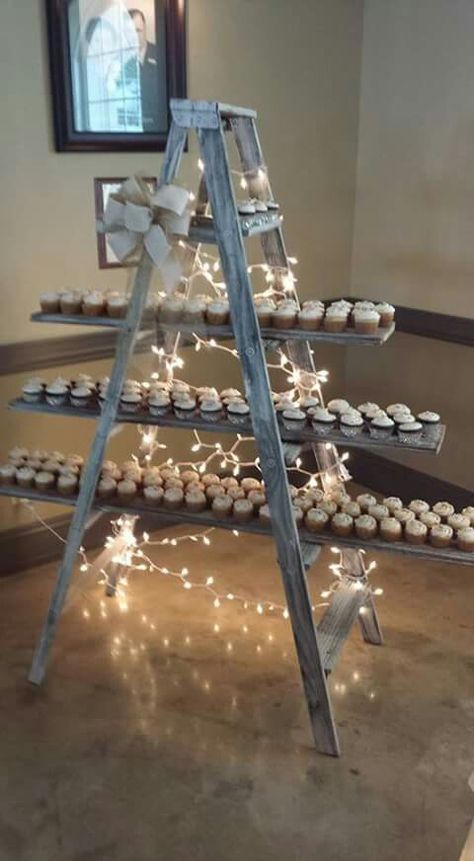 Cupcake ladder Ladder Party Decor, Ladder Cupcake Stand, Graduation Cupcake Display, Cupcake Ladder, Crisp Wall, Treat Tables, Ladder Wedding, Cupcake Wall, Party Rental Ideas