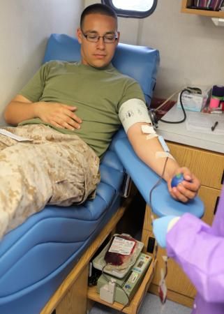 Cpl. Manuel Cedillo, supply specialist, 2nd Assault Amphibian Battalion, 2nd Marine Division, waits patiently while he donates blood aboard Marine Corps Base Camp Lejeune, June 13. The battalion’s medical staff contacted the Naval Hospital Camp Lejeune’s Blood Donor Center and hosted an Armed Services Blood Program blood drive to help with the increasing demand for blood donations in the military. (Photo by Cpl. Andrew Johnston, 2nd Marine Division) Marine Son, Army Medic, Army Couple Pictures, Fake Ft Call, Camp Lejeune, Army Nurse, Army Couple, Blood Drive, Screen Photo