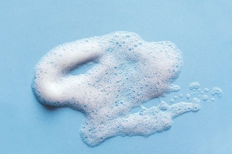 Face cleansing mousse sample. White cleanser foam bubbles on blue background. Soap, shower gel, shampoo foam texture closeup. Foam Photography, Foam Bubbles, Package Illustration, Foam Texture, Copywriting Ads, Soap Foam, Bubble Foam, Laundry Business, Blue Soap