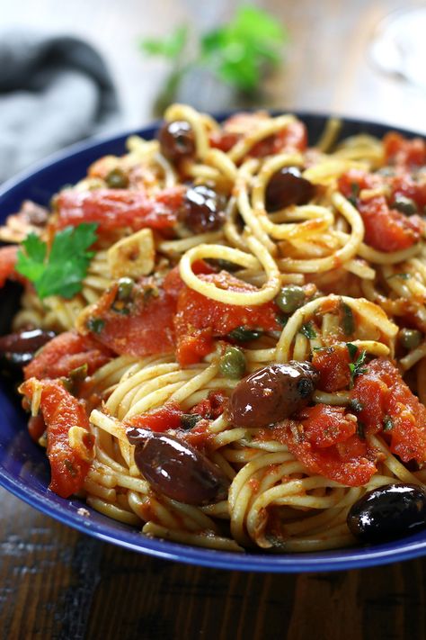 Spaghetti alla Puttanesca is an incredibly simple dinner that is perfect for busy weeknights. This authentic Italian recipe has delicious flavors of garlic, capers, anchovies, olives and tomatoes. Pasta lovers adore this recipe! #Puttanesca #SpaghettiPuttanesca #AuthenticItalianPasta https://www.thefedupfoodie.com Authentic Italian Pasta Recipes, Pasta Puttanesca Recipe, Italian Pasta Recipes Authentic, Authentic Italian Pasta, Anchovy Recipes, Spaghetti Alla Puttanesca, Puttanesca Sauce, Alla Puttanesca, Pasta Puttanesca