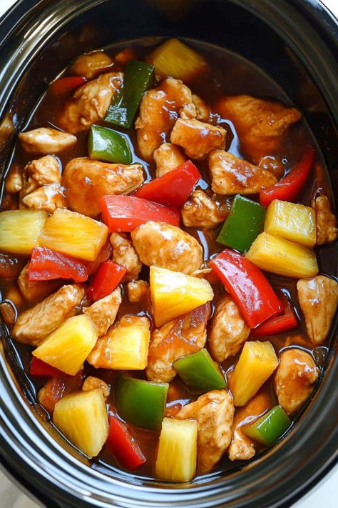 This easy Crockpot sweet and sour chicken is even better than takeout! With just a few key ingredients, you have a dump-and-go meal the family will love. Sweet N Sour Chicken Crock Pot, Crockpot Sweet And Sour Chicken Recipes, Chicken Cubes Crockpot Recipes, Slow Cooker Bbq Pineapple Chicken, Slow Cooker Chicken Stir Fry Recipes, Sweet And Sour Chicken Freezer Meal, Asian Crockpot Meals, Pineapple Chicken Crockpot Easy, Crock Pot Sweet And Sour Chicken