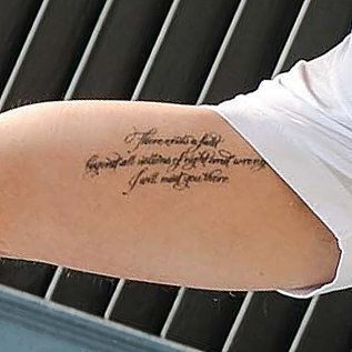 Brad Pitt has a poem from Jalal ad-Din Rumi tattooed on his arm that reads: "There exists a field, beyond all notions of right and wrong. I will meet you there." Brad Pitt Tattoo Arm, Brad Pitt Tattoo, Rumi Tattoo, Brad Pitt News, Private Tattoos, Tattoo Quote, Right And Wrong, Cool Tattoos For Guys, Stomach Tattoos