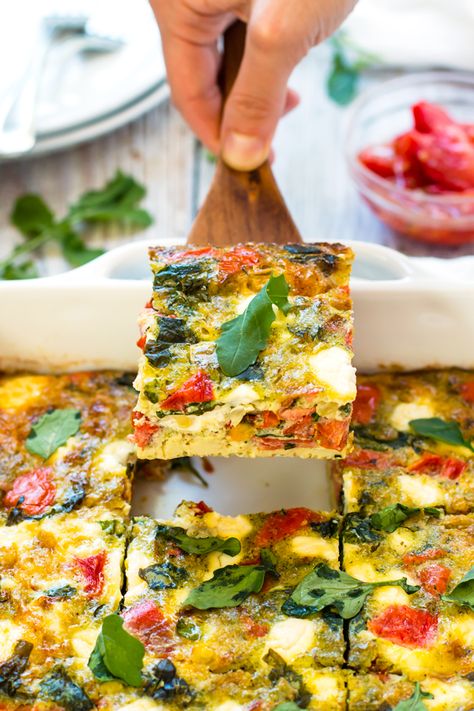 Baked Frittata with Pesto, Tomatoes & Goat Cheese | An easy breakfast bake full of eggs, roasted tomatoes, pesto and goat cheese. It makes a healthy vegetarian and gluten-free breakfast recipe! Goat Cheese Egg Bake, Pesto Egg Bake, Healthy Breakfast Bake, Fritata Recipe, Healthy Breakfast Baking, Baked Frittata, Goat Cheese Frittata, Breakfast Frittata, Veggie Frittata