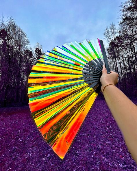 Iridescent hand fan being held and displayed shimmering in the light Festival Gadgets, Music Festival Accessories, Festival Must Haves, Must Have Gadgets, Hand Fans, Festival Accessories, Stationery Organization, Hot Day, Summer Festival