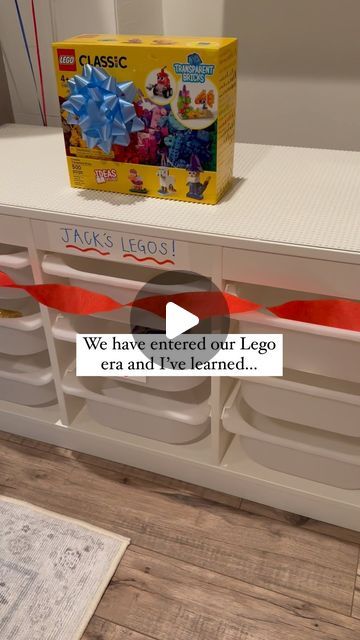 Kaitlyn Rowe on Instagram: "*Check out stories — or comment below — for a link to our favorite Lego finds!  My older two kids have officially entered their Lego era and it’s been so fun. It’s all new to me and I’ve learned a thing or two alongside them these past couple of months.. like I personally had no idea all duplo legos worked with small original lego bases and it’s been so nice having all of our sets in one table for extending play + easy organizing.   Also, peel & stick bases on Amazon were one of my favorite finds yet. They made DIYing an IKEA table into a lego table so simple, plus they make the best vertical walls for displaying creations — my kids are obsessed!   If you have any fun lego hacks/tips, let me know 🤩" Lego Table Storage Ideas, Lego Trofast Table, Lego Storage Play Area, Portable Lego Table, Under Stairs Lego Room, Trofast Lego Table Ikea Hacks, Kids Lego Corner, Ikea Hack Lego Storage, Lego Build Station