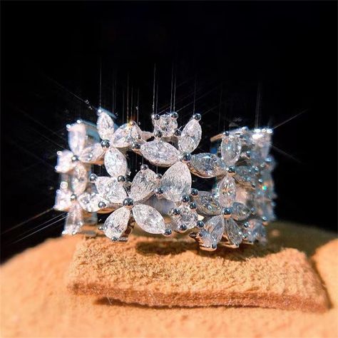 PRICES MAY VARY. 🌻 ：100% brand new imported high quality materials. 💎 ：18k gold plating process. Top quality AAA cubic zirconia stone. 🌟 ：Perfect full diamond double flower design,Shiny Gems, Exudes a Mysterious and romantic atmosphere.No woman can stop its charm . 💖 ：This ring is a beautiful and elegant cocktail ring, a perfect anniversary gift, wedding gift, mother's day gift, birthday gift, holiday gift or gift, I love you! 👍 SERVICE：If you have any questions, please contact us, we will Flower Wedding Band, Flower Diamond Ring, Stackable Wedding Bands, Sterling Silver Wedding Band, Silver Wedding Jewelry, Party Women, Flower Engagement Ring, Moissanite Diamond Rings, Silver Wedding Bands