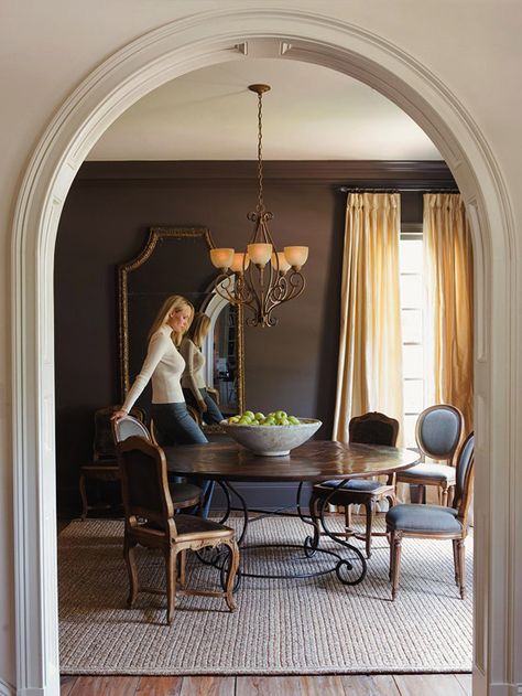 My future dream home features high-end craftmanship like this archway with great moulding detail. Archway Into Dining Room, Arch Dining Room Wall, Brown Paint Dining Room, Archway Dining Room, Arched Dining Room Entry, Brown Dining Room Walls, Arch Moulding On Wall, Same Color Walls And Trim, Arc Doorway