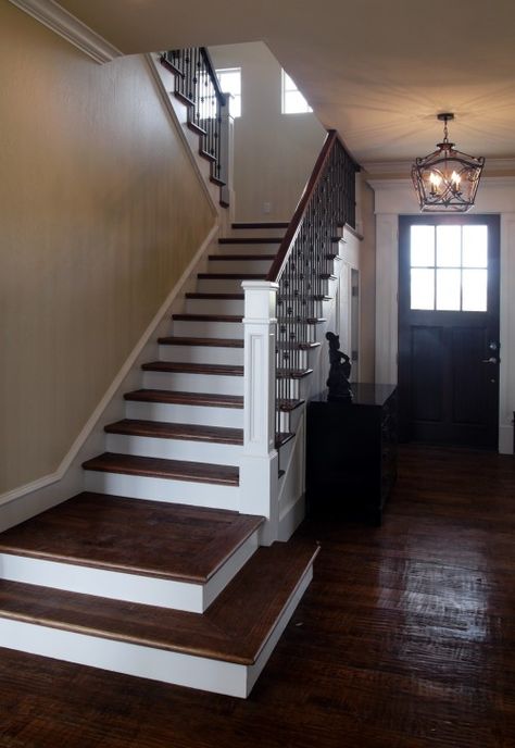 Hand scraped dark wood floors with white woodwork - definitely the way to go. Stairs Landing Design, Craftsman Staircase, Craftsman Trim, Traditional Staircase, Iron Stair Railing, Iron Staircase, Entry Stairs, Staircase Remodel, Staircase Makeover