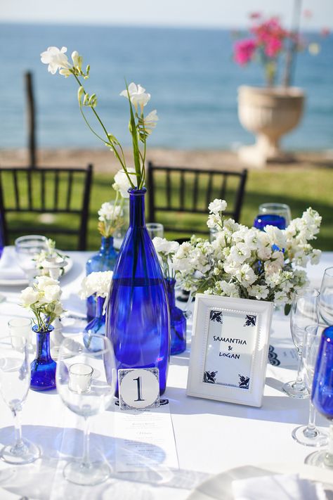 Photography: Kate Price Photography - katepricephotography.com  Read More: http://www.stylemepretty.com/destination-weddings/2014/10/01/fun-sayulita-mexico-wedding/ Cobalt Blue Vases, Blue Glass Centerpieces, Cobalt Blue Flowers, Cobalt Blue Centerpieces, Blue Glass Wedding Decor, Cobalt Blue Wedding Colors, Cobalt Blue Glass Decor, Cobalt Blue Vase Centerpieces, Blue Glass Wedding