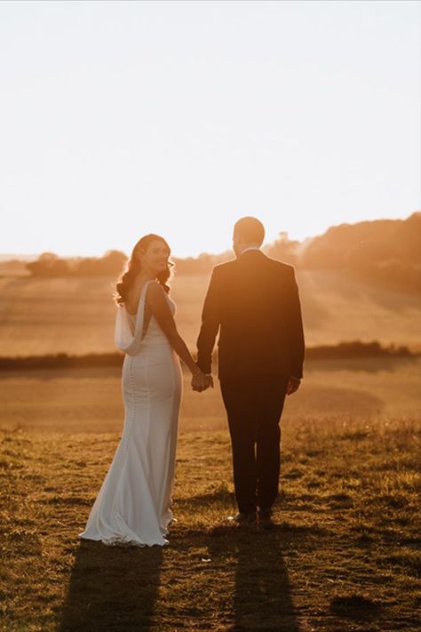 Golden hour couple portrait with the bride in a cowl back wedding dress and groom in a navy suit admiring the views in Kent Cowl Back Wedding Dress, Wedding Walk, Golden Hour Wedding, Sunset Wedding Photos, Golden Hour Photos, Golden Hour Photography, Yosemite Wedding, Bride Groom Photos, Wedding Details Photography