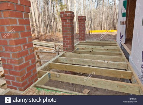 New home construction wood framing details of a porch with brick columns Stock Photo Simple Wood Bed Frame, Wood Porch Columns, Long Wood Box, Wood Bed Frame Queen, Hickory Wood Floors, Brick Pillars, Light Wood Bed, Wood Box Centerpiece, Light Wood Kitchens