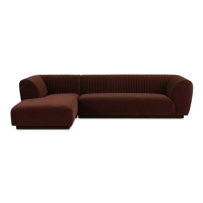 The Thambu sectional brings a tasteful touch to any room with its plush velvet upholstery, a soft touch with subtle elegance. Its vertical channel detailing along the back and arms adds a sophisticated visual texture, while the warm, neutral color allows it to blend seamlessly into any décor without overwhelming. Orren Ellis Orientation: Left Hand Facing, Body Fabric: Brown Polyester | Multi Color Sectional - Orren Ellis Thambu Sectional 27.5 H x 116.75 W x 71.0 D in red / brownPolyester | 27.5" Tan Couch Living Room, Brown Velvet Sofa, Tan Couch, Large Sectional Sofa, Modular Couch, Brown Couch, Sleeper Sectional, Subtle Elegance, Row House