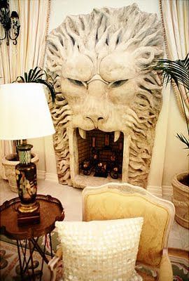 Lion-shaped fireplace, from the home of Kimora Lee Simmons Cave Decorations, Modern Lofts, Tailgate Bench, Cave Bathroom, Cave Room, Automotive Furniture, Fire Places, Automotive Decor, Garage Bar