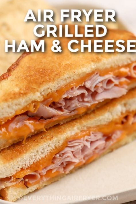 Air Fryer Grilled Ham & Cheese sliced on a plate with writing Bacon Airfryer, Grilled Ham And Cheese Sandwich, Air Fryer Grilled Cheese, Ham And Cheese Sandwiches, Ham And Cheese Toastie, Fried Ham, Air Fryer Recipes Snacks, Grilled Ham And Cheese, Recipe Lunch