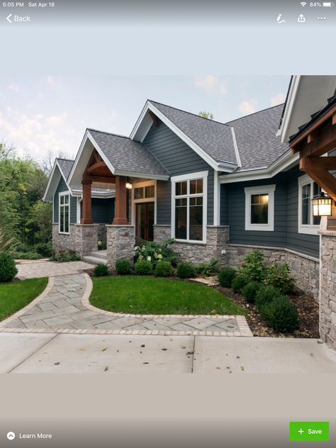 Blue Siding And Stone Exterior, Blue Grey House Exterior With Stone, Grey House With Cedar Accents, Homes With River Rock Exterior, Dark House With Light Stone, Navy And Stone House Exterior, Light Gray Stone Exterior, Dark Blue Siding With Wood Accents, Dark Siding White Trim