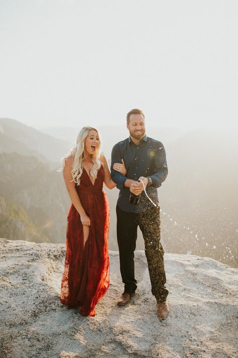 Couples Photos Red Dress, Engagement Dress Fall, Engagement Photos Burgundy Dress, Flowy Engagement Photo Dress, Burgundy Engagement Pictures Outfit, Engagement Photos Dress Outfits, Red Dress Couple Photoshoot, Red Dress Engagement Pictures, Engagement Photos Red Dress