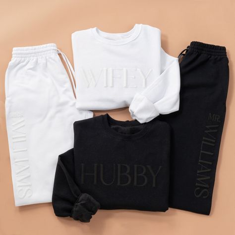 Beautiful Wifey / Hubby Sweatsuits personalized with the last name on the joggers. Additional personalization options are available for the chest, and/or the cuff (see images for options). Order both sets for an amazing Honeymoon Outfit. Perfect Bachelorette Gift, Bridal Shower or Wedding Gift. White Bride Sweat Suit, White Bridal Sweatsuit, Mr And Mrs Outfits, Wedding Gifts For Him From Bride, Wedding Exit Outfit Sweats, Hubby And Wifey Sweatshirts, Bride Sweat Suit Wedding Day, Sweat Suit Wedding Exit, Honeymoon Matching Outfits