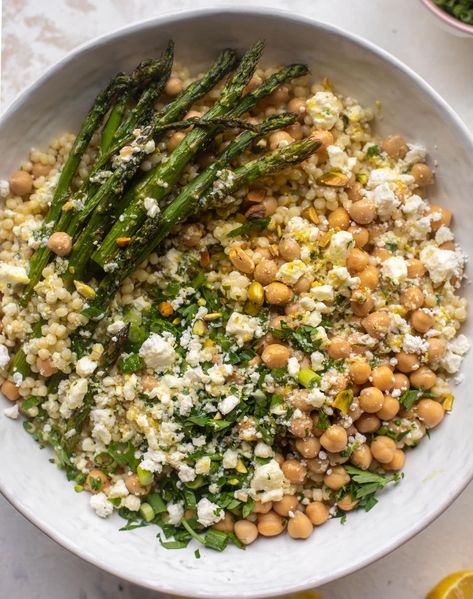 spring couscous bowls with lemon feta vinaigrette Feta Vinaigrette, Couscous Bowls, Spring Eats, Couscous Salat, Sides Recipes, Spring Dinner, Roasted Asparagus, Spring Recipes, How Sweet Eats