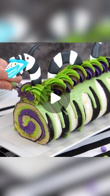 Food Network on Instagram: "If you say “Beetlejuice” three times, this cake roll will appear in front of you 🪲🧃The juice is loose, @SprinkleBakes!  @BeetlejuiceMovie only in theaters September 6! #Beetlejuice #Beetlejuice  Recipe link in @FoodNetwork's bio." Beetle Juice Charcuterie Board, Birthday Cake Roll, Halloween Cake Roll, Beetlejuice Cupcake Ideas, Beetlejuice Recipe, Beetle Juice Cupcakes, Beetlejuice Movie Night Food, Beetle Juice Cake Ideas, Beetlejuice Dessert Ideas