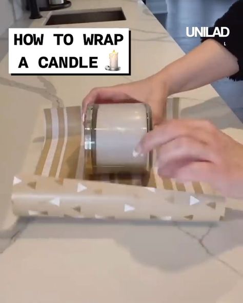 How to wrap a candle | candle | Finally! A way to wrap a candle without it looking like Christmas cracker 😂 | By GOODLAD Wrap A Candle For Christmas, Candles Wrapping Ideas, How To Wrap Candles For Christmas, Gift Wrapping A Candle, How To Wrap A Jar With Wrapping Paper, Wrapping Candles For Christmas Gifts, How To Wrap Candles Gift Packaging Ideas, How To Wrap A Candle For Christmas Gift, Gift Wrap Candle