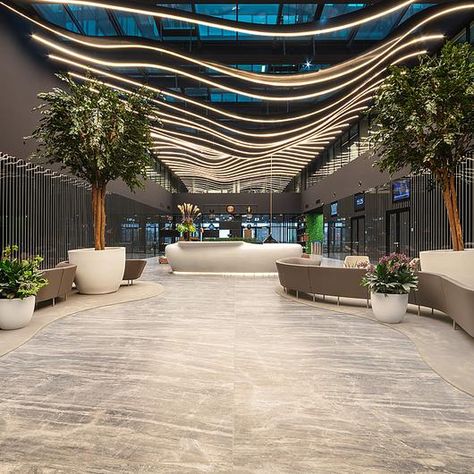 Coverlam Medusa from Grespania in Hillside Office Building, Budapest, Hungaria Building Entrance, Cool Office Space, Plafond Design, Farmhouse Barndominium, Office Space Design, Lobby Interior, Luxury Office, Building Homes, Barn Homes