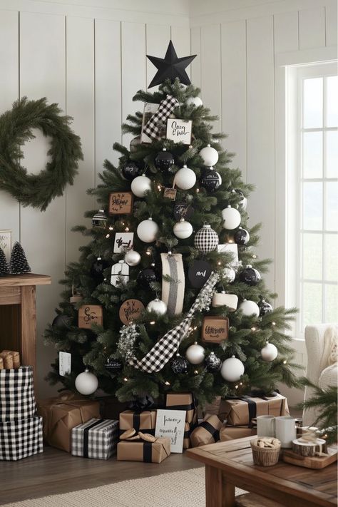 For a sleek, modern look, go minimalist with a black and white Christmas tree. Matte black ornaments and white lights create a strikingly simple look. Imagine how this could add a touch of sophistication to your home! Do you like the idea of a minimalist holiday style? Frosted Tree With Black Ornaments, Flocked Christmas Trees Decorated Black And White, Black White And Tan Christmas Tree, Black And Neutral Christmas Tree, White Christmas Tree Color Schemes, Gray And White Christmas Tree, Christmas Tree Black Ornaments, Modern Black Christmas Tree, Christmas Tree With Black Ornaments