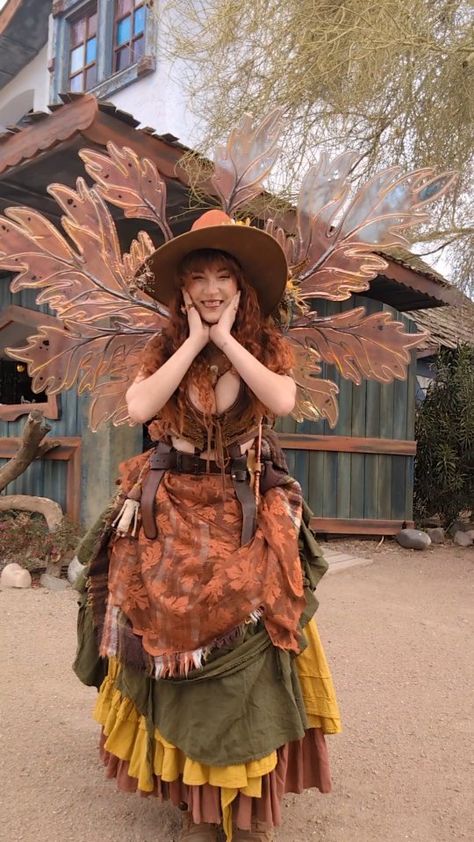 ᎮᎩᎮᎮᎥᏁ ᎧᏗᏦᏕᏂᎥᏒᏋ on Instagram: “Who's ready for Renaissance Festival season?!?! 🧡🍁🧡 Wings @wearablewhimzy Leather tops new pterodactyl leather Vest…” Renisance Fair Fairy Outfit, Ren Faire Costume Plus Size, Cool Ren Faire Outfits, Easy Renfaire Costume, Orange Ren Faire Outfit, Cottage Core Cosplay, Ren Fest Outfits Plus Size, Faerie Ren Faire, Fairy Rennaisance Outfits