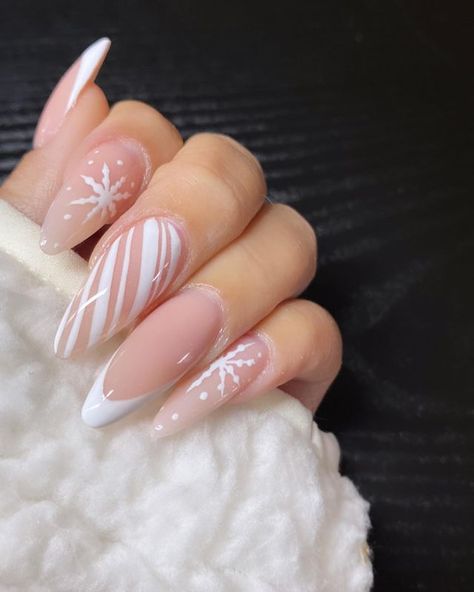 35 Elegant White Winter Nails to Try White Xmas Nails Almond, White Almond Nails Christmas, White Christmas Nails Almond Shape, Cute White Winter Nails, Long Almond Nails Designs Winter, Long Almond Nails Winter, Christmas White Nail Designs, Long Almond Nails Christmas, Non Christmas Winter Nails